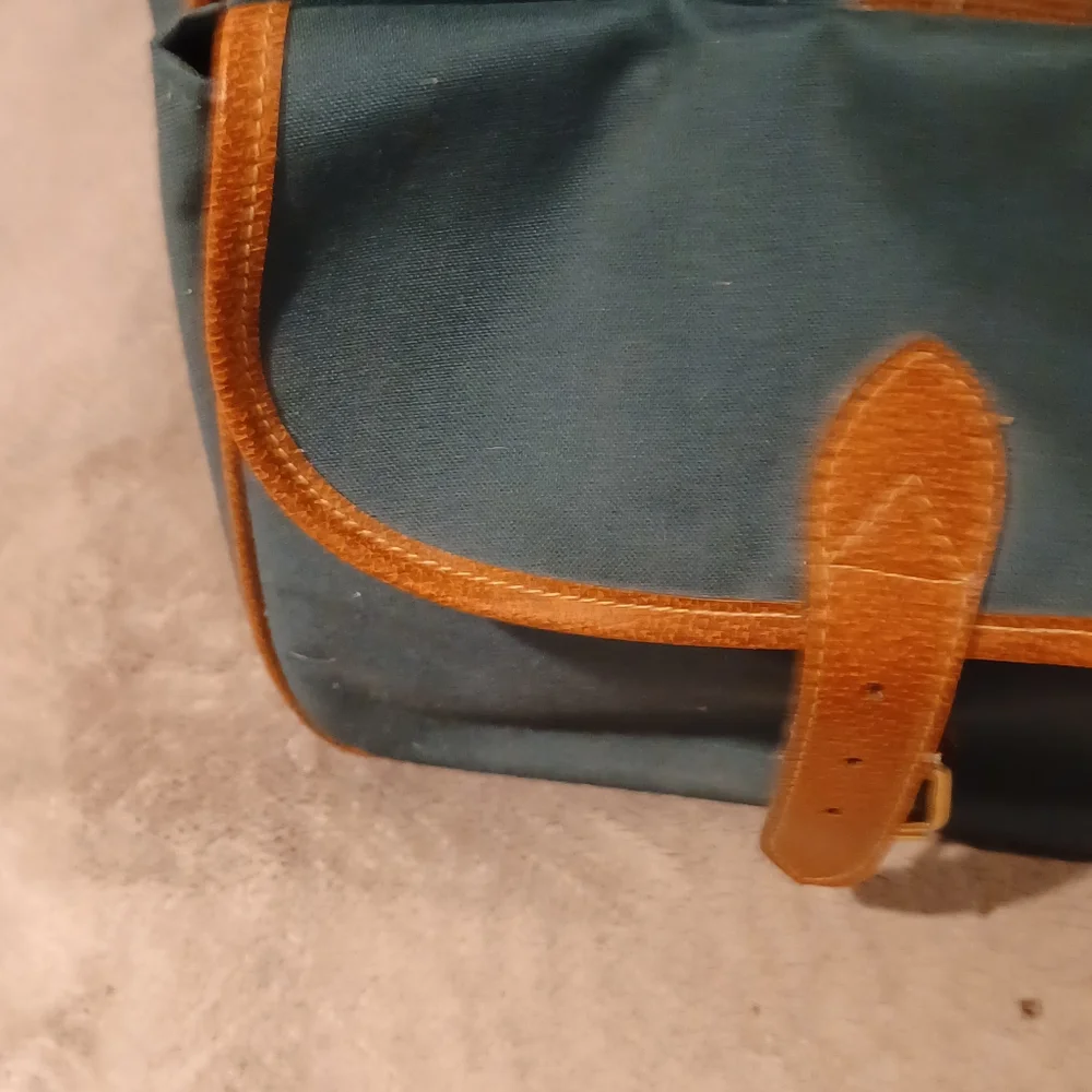 Duffle bag fancy straps are nice accents to this bag